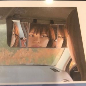 VEHICLE MOUNTED FOLDING VANITY MIRROR.